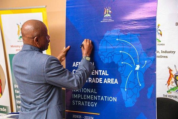 Gen-Mbadi-signs-on-Ugandas-AfCFTA-Implementation-Strategy