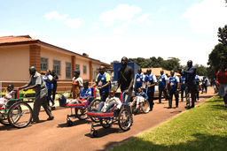 Some-of-the-hospital-staff-and-partners-walking-alongside-some-the-children-treated-at-the-CoRSU-Hospital-scaled